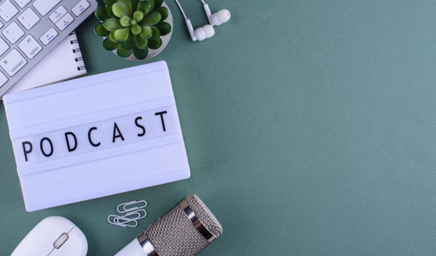 Podcast new episode concept. Workplace desk of blogger or podcaster with microphone SSUCv3H4sIAAAAAAAACpyRwW7DIAyG75P2DhHnRmpIlpC+SrWDQ0iDSqEC0mmq+u4zECrOu+HP9m//5vn5UVVkAic5OVXPEGEsldqct+Cl0YiPh51boWdhS/KwbX8sgZilN1aCKuEEnq8abgKh3pQK+BWTxHnwmxMuTN8RBy8uqJHgWyKteE5xlRMxiR2YIuRQMLdNkWWUxP/VmR7f2Q1chOa/ceHCiBVKQDJyTqXk+uOFvZXWYJulKVw9DAcVCtpC6W4ll/pStBm/xrPnNm427W1Y4b05UcbcYVLhxAtqisxXcA7L58yLQRw/2dyKOdr4aGBXJTP+RAibljJGh2Zs6IBPyrq9IP3eKlEnrpOFMOZXOZfWZdiA0JECUNHVA2NfdXfsWQ0t4/XCp34Y6DKOvMfDv/4AAAD//wMAnhnldJgCAAA=