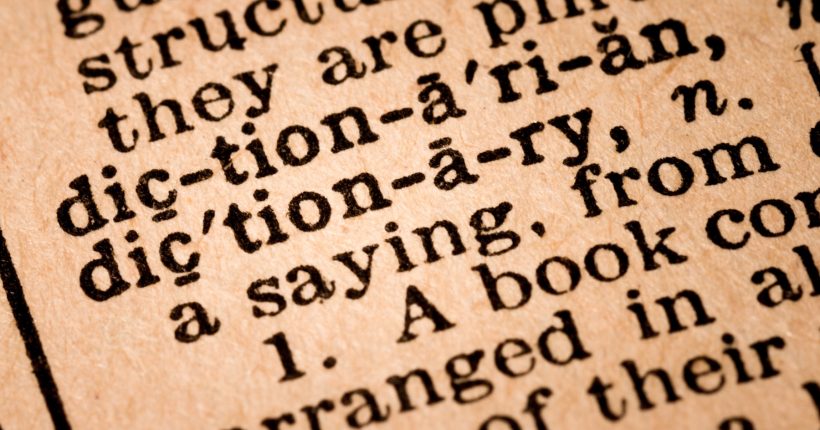 October 1st, 2015 - Montreal, Canada. Close-up of an Old 1945 Webster Vintage Dictionary showing the Word DICTIONARY